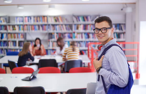 istock the student uses a notebook, latop and a school library 1310219271