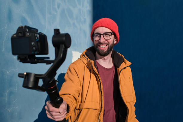 istock videographer recording himself with a dslr camera on a motorized gimbal 1310221150