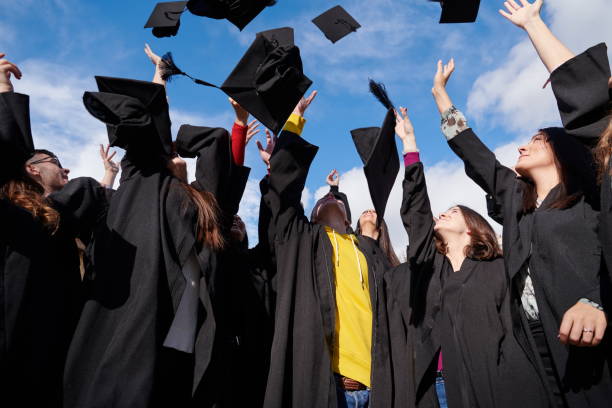 istock Group of diverse international graduating students celebrating 1310221953