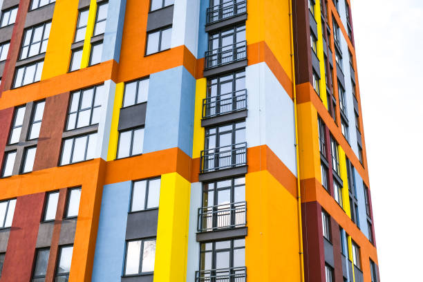 istock Modern building angle and windows. Multistory new multicolored apartment building. Stylish living block of flats. Bright juicy colors in the construction of buildings 1310222063