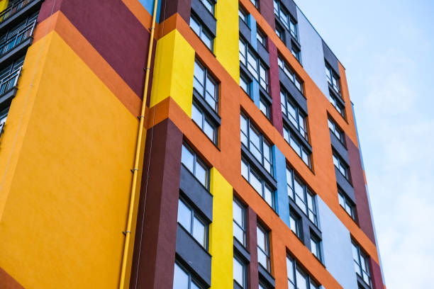 istock Modern building angle and windows. Multistory new multicolored apartment building. Stylish living block of flats. Bright juicy colors in the construction of buildings 1310222066