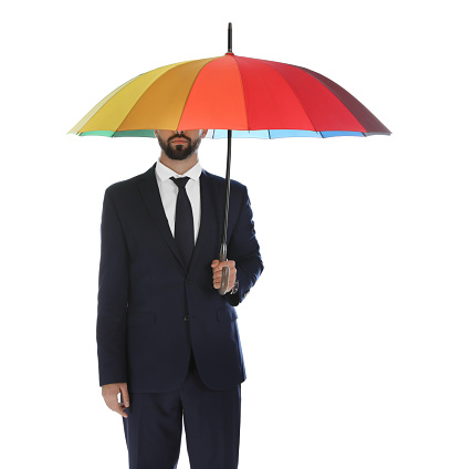 Businessman with rainbow umbrella on white background