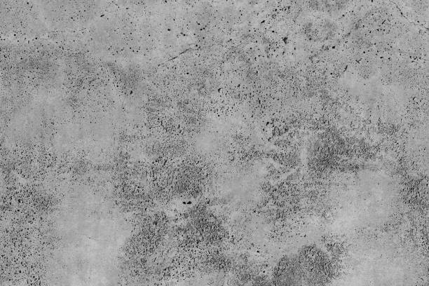 istock Concrete with crack broken in floor wall texture. Chapped surface asphalt old cement stone. Natural destruction from time and weather conditions. Non-color, monochrome black and white photo. 1310223159