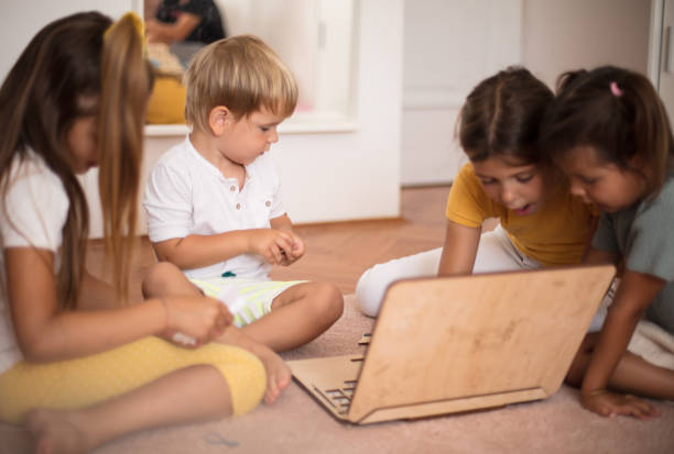 istock Large group of kids playing interactive games. 1310223921