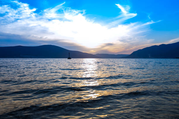 istock Sunset over the sea and mountains 1310225718
