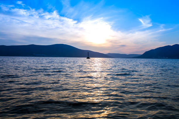 istock Sunset over the sea and mountains 1310225719