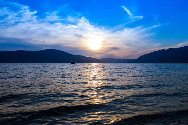 istock Sunset over the sea and mountains 1310225734