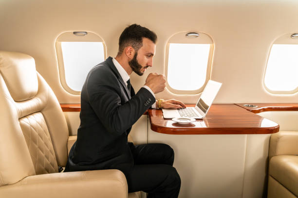 istock Businessman flying on private jet 1310226222