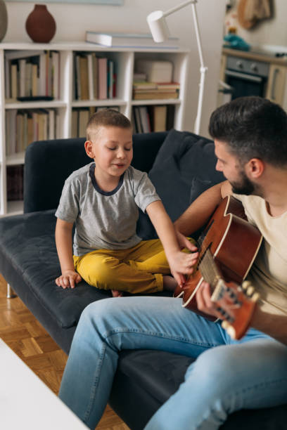 istock father and son spending time together at home 1310227319
