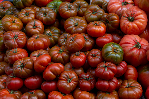 Picture of a lot of colorful and healthy tomatoes in a street market in Spain