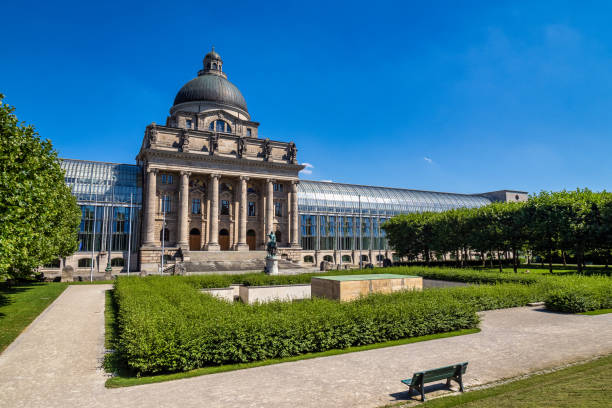 View of famous State chancellery - Staatskanzlei in Munich, Germany Munich, Germany - Jul 27, 2020: view of famous State chancellery - Staatskanzlei with war memorial in the German city center of the Bavarian capital. bavarian state parliament stock pictures, royalty-free photos & images