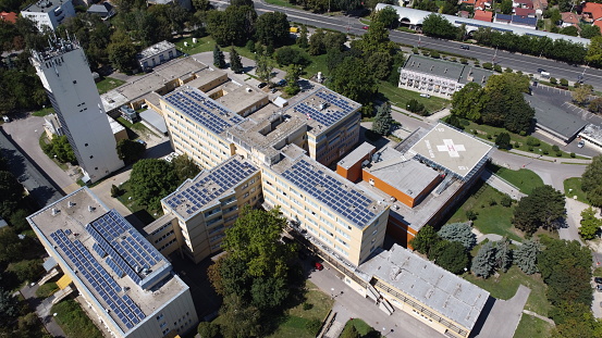 A solar panel powered hospital in a nice green area