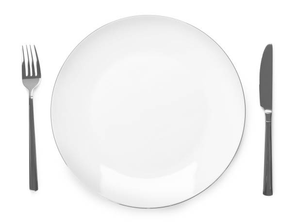 istock Plate and cutlery on white background, top view 1310236239