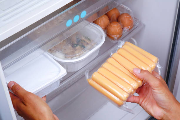 istock A man is putting the food in the refrigerator. 1310236414