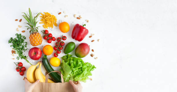 istock Hands holding a paper bag with healthy food 1310236713