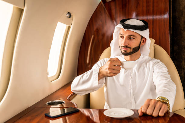 istock Arabian man wearing kandora flying on private jet 1310239394