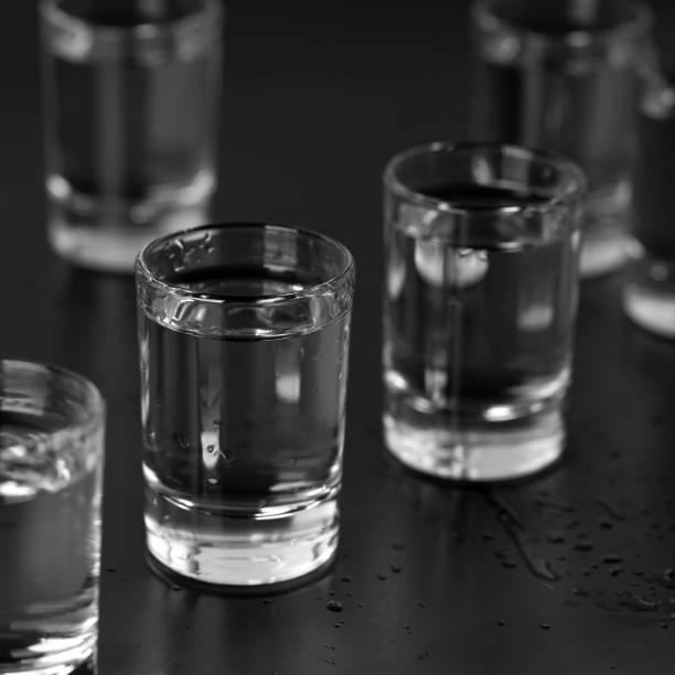 istock Vodka, rum, tequila, gin are poured into glasses at the bar. 1310239560