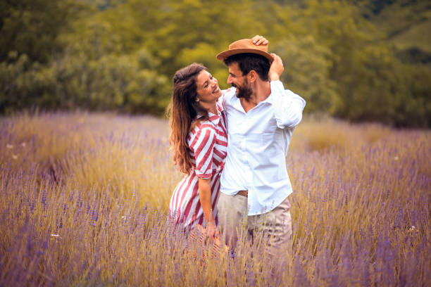 istock Couple in hug standing in lavender field. 1310239586