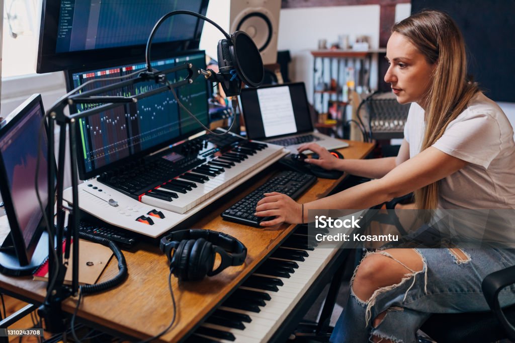 In Her Cozy And Modern Music Studio Focused Young Female Music Producer  Doing The Post Production Part For Her Client Stock Photo - Download Image  Now - iStock