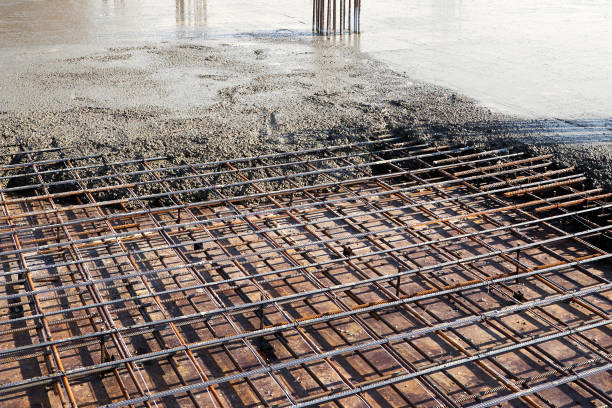 istock Pouring concrete on the floor of a building under construction 1310245083