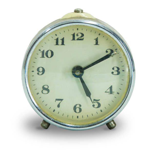istock Retro alarm clock isolated on white background. 1310245900