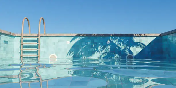 Photo of swimming pool with rusty stairs filling with clear sky