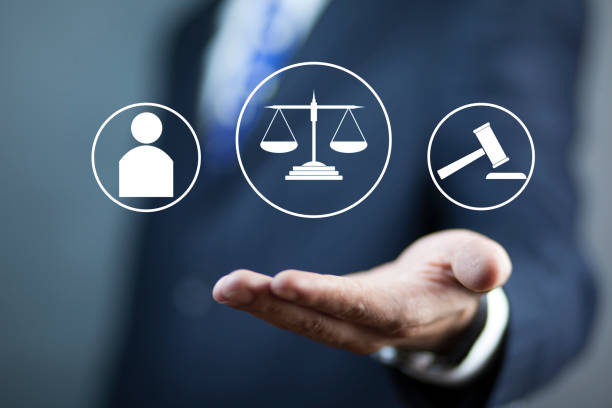 istock Lawyer hand a justice concept 1310249335