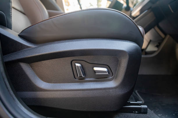 istock car seat electronic switch button. lever for electronic seat adjustment in a modern premium car. seat memory option 1310250071