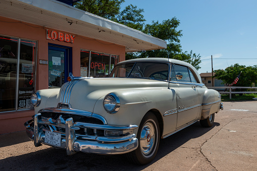Tucumcari, New Mexico - July 9, 2014: A vintage Pontiac car parked along the US route 66 in the city of Tucumcari , in the State of New Mexico, USA.