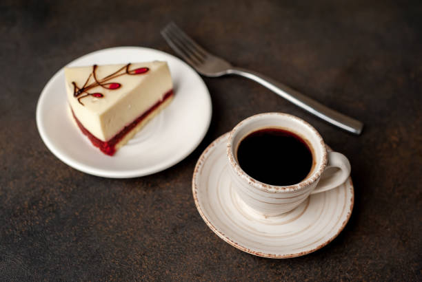 istock Coffee and tasty cheesecake on a plate on a stone background 1310252391
