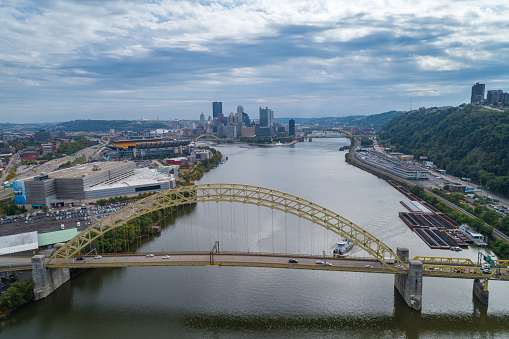 West End Bridge in Pittsburgh, Pennsylvania. Beautiful Cityscape, Skyline in Background. Cloudy Blue Sky