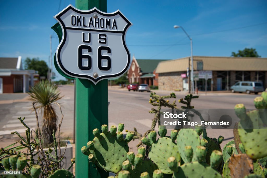 Detail of a US route 66 road sign in a town in the State of Oklahoma Detail of a US route 66 road sign in a town in the State of Oklahoma, USA. Concept for road trip in the USA. Oklahoma Stock Photo