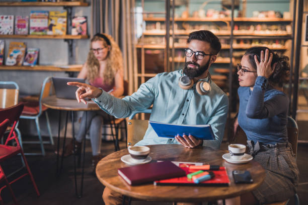 istock What is going on there? Man pointing in something while female looking at it. 1310256832