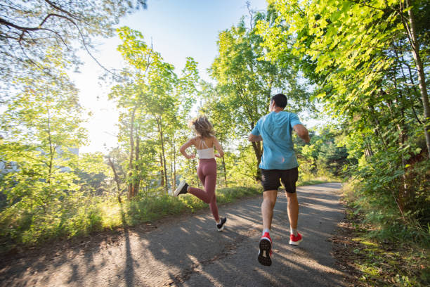istock Healthy couple jogging in nature. 1310257644