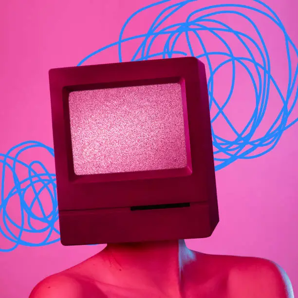 Photo of Young woman headed of TV set isolated over pink background.