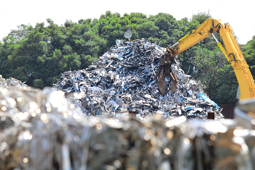 A pile of scrap iron, scrap, stainless steel, and rusted iron scrap from industrial metal waste