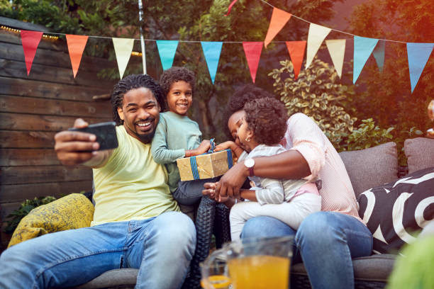 istock Father with family making selfie on b-day celebration 1310258819