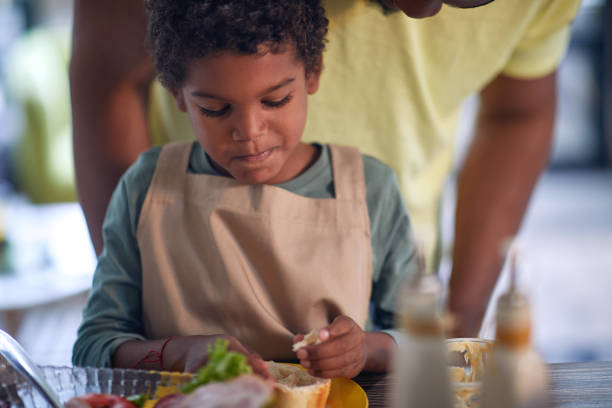 istock Afro American boy having breakfast at home. 1310258898