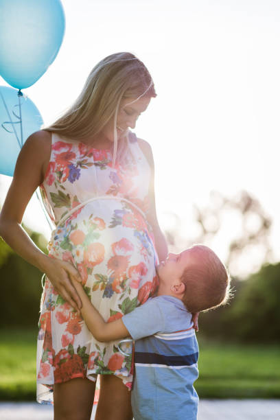 istock Pregnant mother and her son sharing love 1310259092