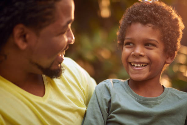 istock Smiling father and son enjoying and having fun together at home. 1310260144
