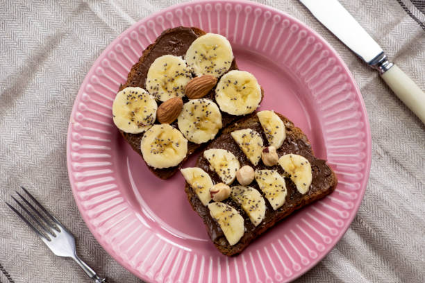 istock Toasted whole wheat bread with chocolate nuts paste nutella topping 1310260377
