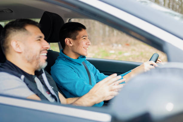 istock Teenage boy having driving lesson with male instructor 1310261533
