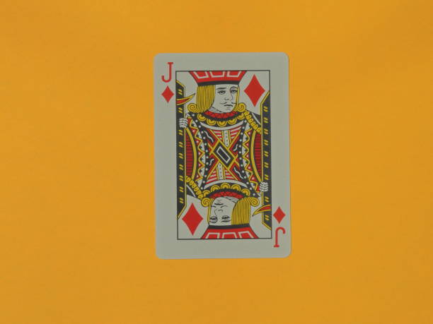 istock A Jack of Diamonds playing card on a yellow background. Macro. Bubey. Jack. 1310263596