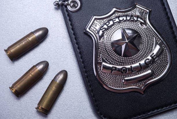 istock Police badge next to bullets, concept image 1310268421