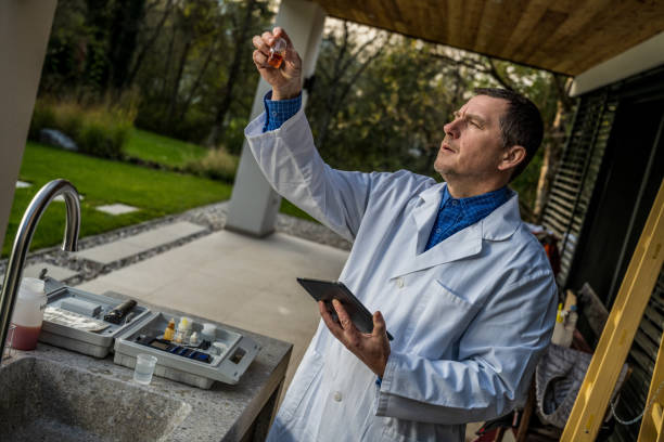 istock Male biologist examining water sample 1310268924