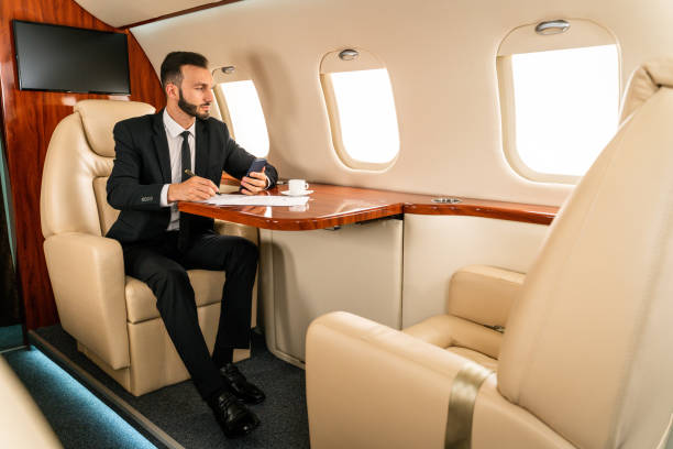 istock Businessman flying on private jet 1310269649