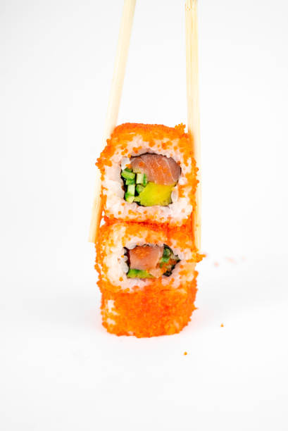 istock california maki rolls with flying fish roe on white background 1310269791