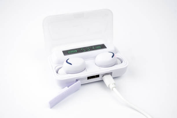 istock white true wireless earbuds with digital display in plastic charging box, isolated on white background 1310269834