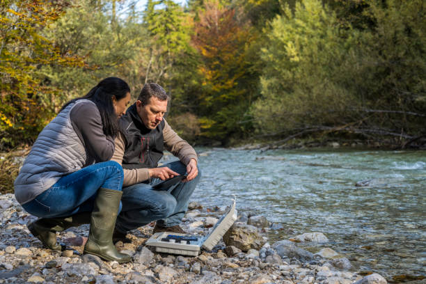 istock Male and female biologists using digital tablet 1310270204