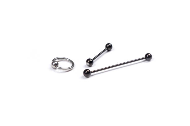 istock set for piercing on a white background,barbell to tongue 1310271252